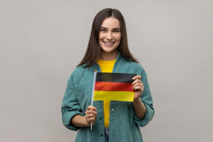 woman-holding-germany-flag-celebrating-day-germany-th-october-expressing-positive-emotions