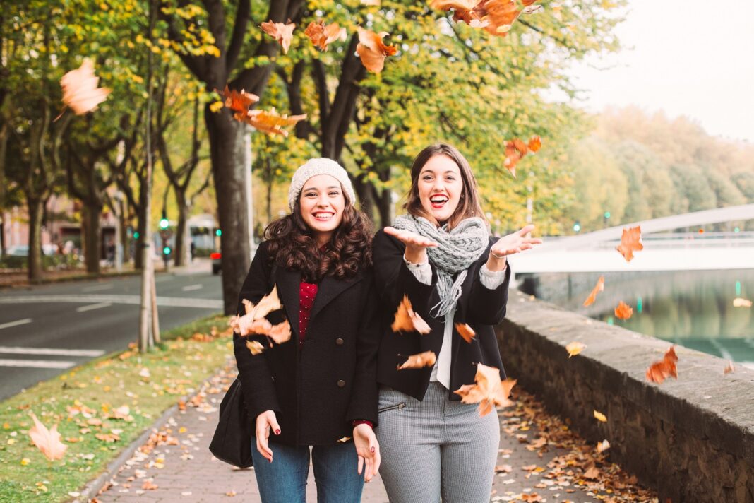 Urban funny girls enjoying autumn