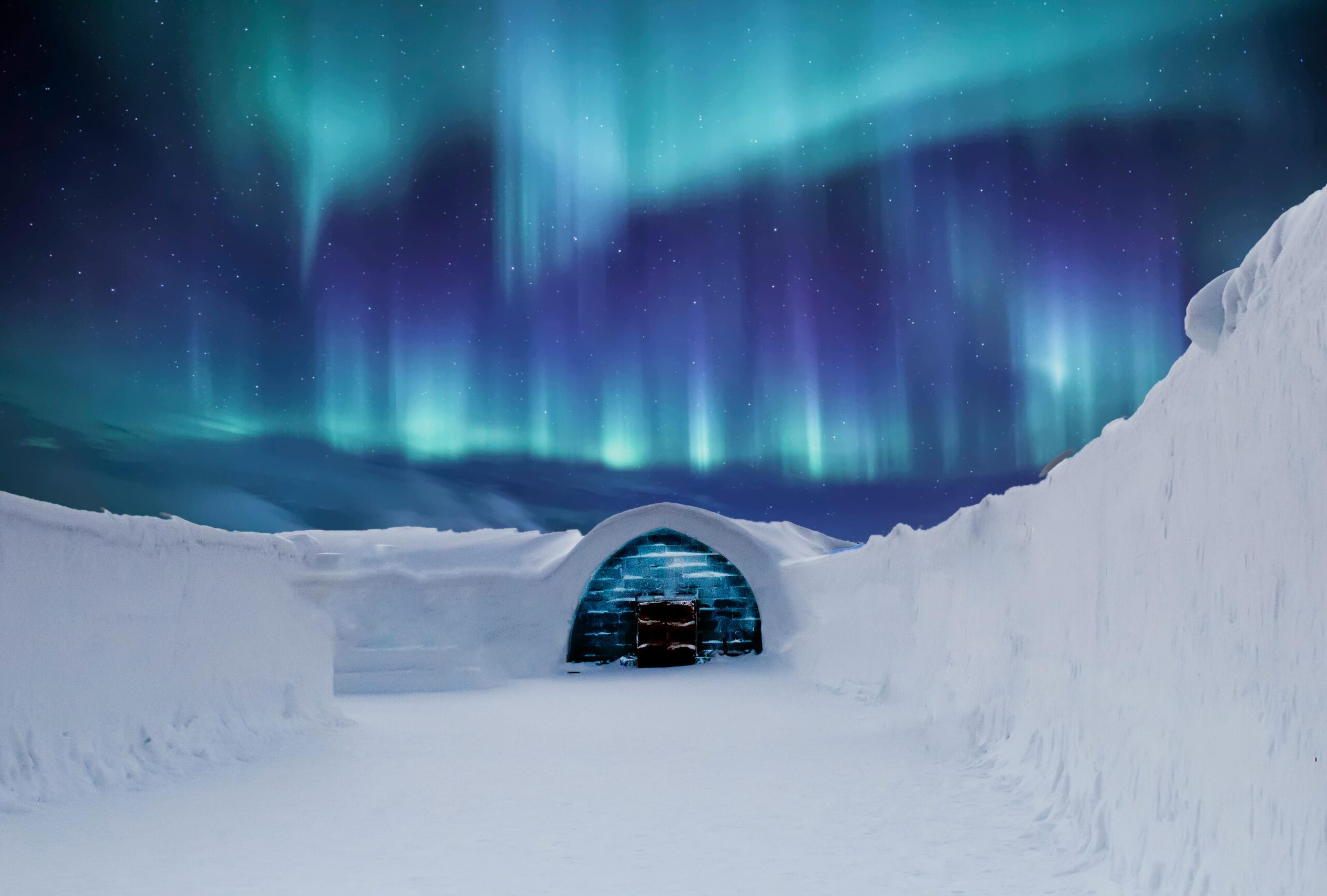Urzekająca zorza polarna oświetla nocą zaśnieżone igloo w arktycznym krajobrazie.