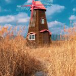 Malowniczy widok na wiatrak stojący wysoko na polu pszenicy pod błękitnym niebem w Incheon.